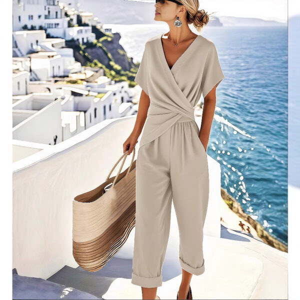 5e193a31-75ab-4b3a-aa76-584c77de41a2.jpg Women's Two Pieces Set Fashion Solid Color Irregular Short Sleeve Suit Summer Fashion V Neck Slim Office Suit Casual Pleated Irregular Top And Pants Female Outfit